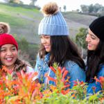 Lifestyle blogger Debbie Savage of To Thine Own Style Be True sharing her love for ILYMIX Fashion Accessories with her two daughters wearing Faux Fur Pom Pom Beanie